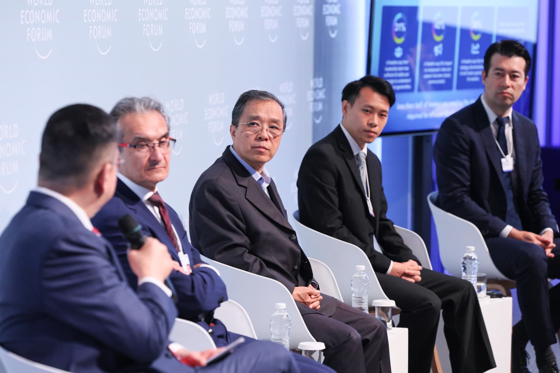 Qiqing He listening during an Adecco Group expert panel at the World Economic Forum Annual Meeting of the New Champions