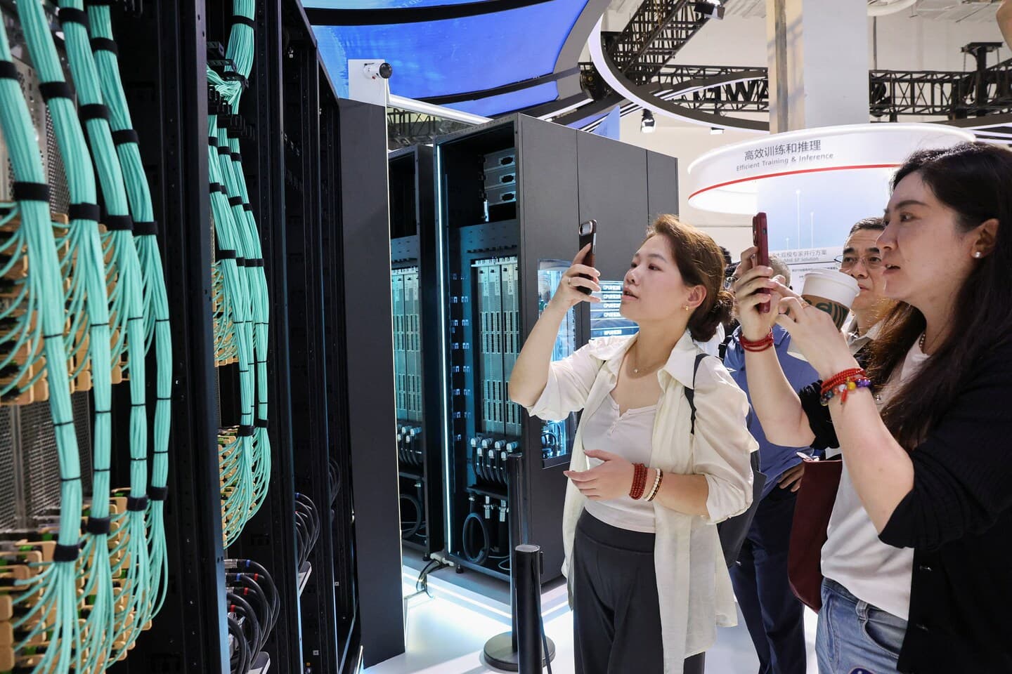 Visitors viewing an AI cluster server at the Huawei booth during the World Artificial Intelligence Conference in Shanghai